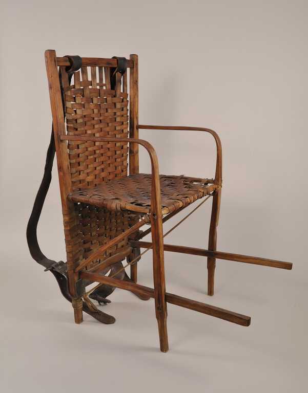 Wood-framed chair used by Jack Huff to carry his mother, Martha Whaley Huff, to 